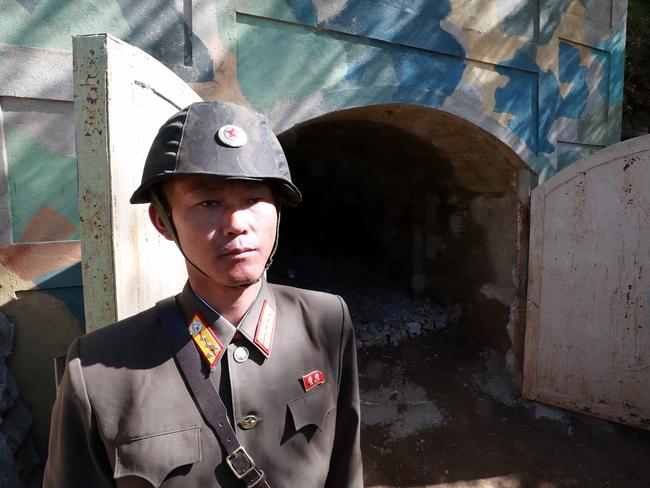 PUNGGYE-RI, NORTH KOREA - MAY 24: (SOUTH KOREA OUT) In this handout image provided by the News1-Dong-A Ilbo, a North Korean soldier stands at the entrance to a tunnel at the Punggye-ri nuclear test site on May 24, 2018 in Punggye-ri, North Korea. North Korea dismantled their nuclear testing facility at Punggye-ri in front of the international media. (Photo by News1-Dong-A Ilbo via Getty Images)