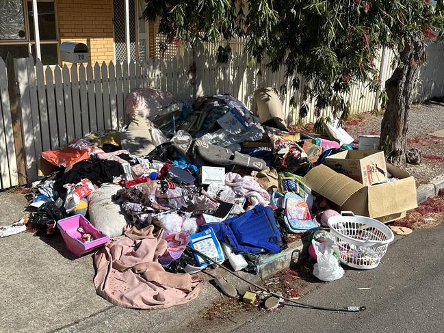 A Campbelltown housing trust home left with piles of rubbish dumped outside. Picture: Supplied