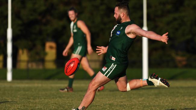 Anch Papa gets a kick away for Wantirna South. Picture: James Ross/AAP