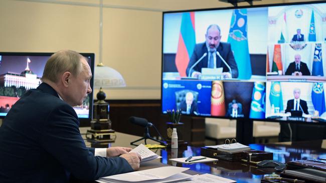 As Vladimir Putin approaches his 70th birthday this year, after 22 years in power, he wants to be known as the leader who put Russia back together after the Soviet collapse. Above, the Russian President attends a video emergency meeting of the Council of the Collective Security Treaty Organisation. Picture: Sputnik / AFP