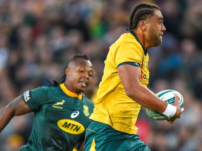 Australia's Lukhan Salakaia-Loto (R) runs with the ball during the 2019 Rugby Championship match, South Africa v Australia, at the Emirates Airline Park in Johannesburg, on July 20, 2019. (Photo by Christiaan Kotze / AFP)