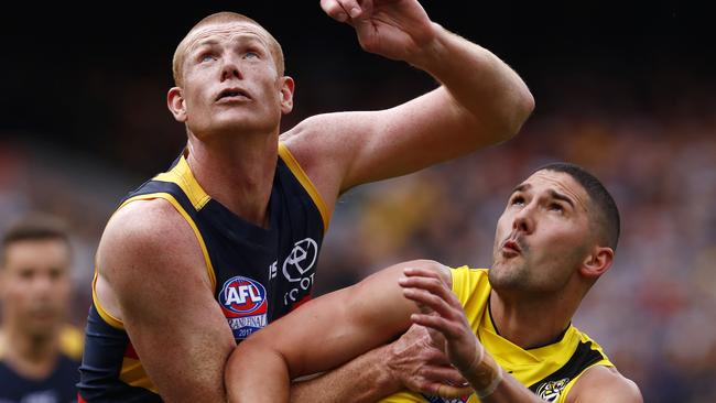 Adelaide’s Sam Jacobs holds off Shaun Grigg. Picture: Michael Klein