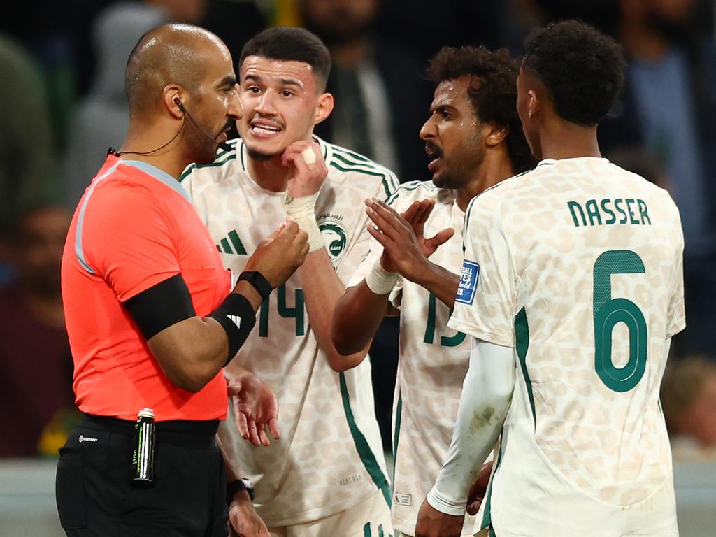 Saudi Arabian players argue with referee Adel al-Naqbi. Picture: Getty Images