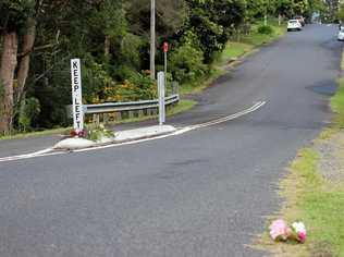 Flowers on Cecil St, Nimbin, where a pedestrian was fatally struck by a vehicle in an alleged hit-and-run incident overnight. Picture: Liana Turner