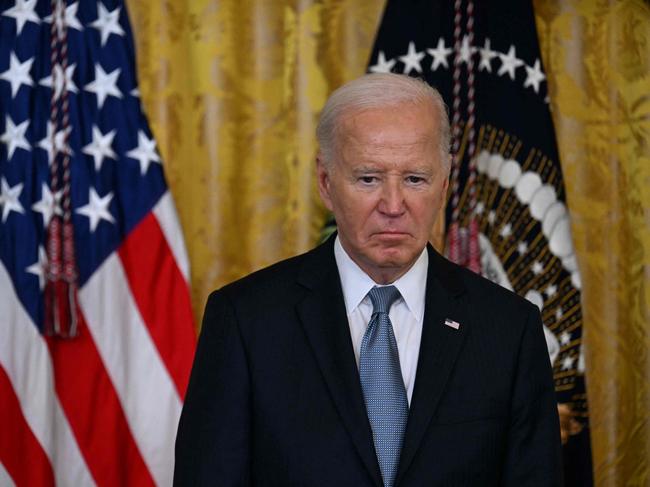 TOPSHOT - US President Joe Biden looks on during a Medal of Honor ceremony in the East Room of the White House in Washington, DC, on July 3, 2024. (Photo by Jim WATSON / AFP)