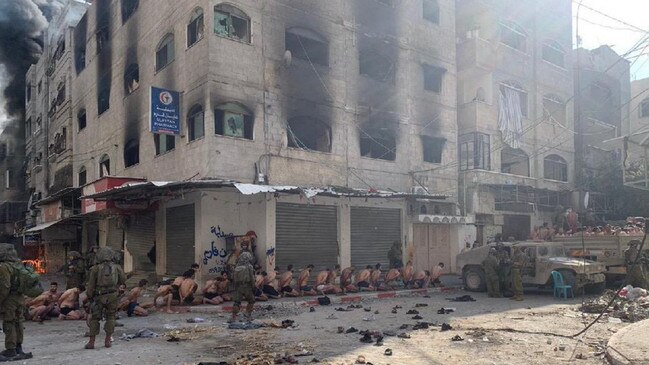 Images also show men in their underwear lined up in the streets of Beit Lahia. Picture: Emannuel Fabia/Twitter/X/The Times