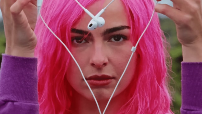 The star has released music videos for her songs Headphones On and High Fashion this year, both featuring Y2K-era staple low-rise jeans (beaded belt included, of course), plus glitter eyeshadow, a diamonte bra, cropped zip-up hoodie, bejewelled belly button, and Xtina-looking blonde and pink hair. Image: Addison Rae on Youtube