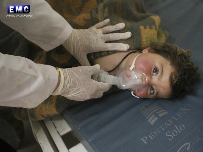 A Syrian doctor treats a child at a makeshift hospital following the suspected attack which Syrian opposition activists described as among the worst in the country's six-year civil war. Picture: Edlib Media Center/AP