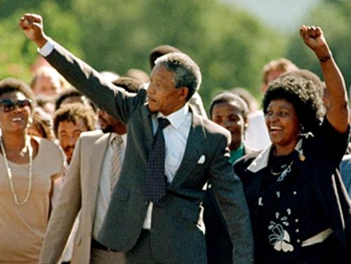 African National Congress (ANC) leader Nelson Mandela and wife Winnie raise fists upon his release from Victor Verster prison, 11 February 1990 in Paarl. After the banning of the ANC in 1960, Nelson Mandela argued for the setting up of a military wing within the ANC. On June 12, 1964, eight of the accused, including Mandela, were sentenced to life imprisonment. Nelson Mandela was released 11 February 1990. AFP PHOTO ALEXANDER JOE