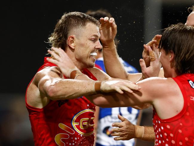 DARWIN, AUSTRALIA - MAY 27: Nick Holman (left) and Bailey Humphrey of the Suns celebrate during the 2023 AFL Round 11 match between the Gold Coast Suns and the Western Bulldogs at TIO Stadium on May 27, 2023 in Darwin, Australia. (Photo by Michael Willson/AFL Photos via Getty Images)