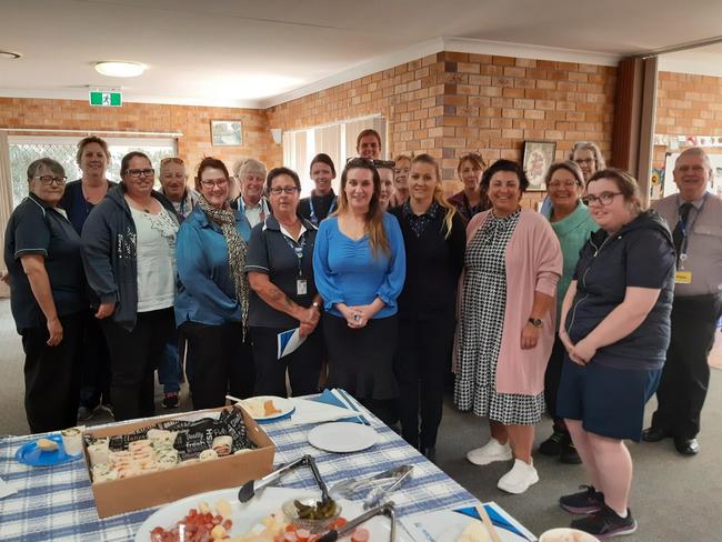 The staff and clients of BlueCare Warwick celebrate 70 years of BlueCare services in Queensland.