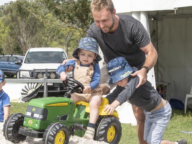 Beau and Parker Cowan have fun with their dad Scott Cowan in the play area. Toowoomba Royal Show. Friday, March 31, 2023. Picture: Nev Madsen.