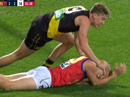 Tom Lynch gives Alex Witherden a whack.