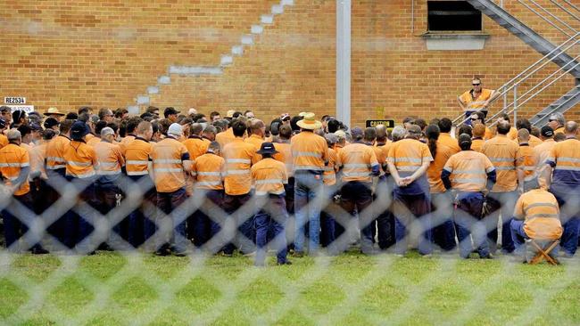 Hundreds of Aurizon rail workers at the Redbank rail workshops attend a union meeting at the facility in 2014. Aurizon planned to close the facility but today announced a new deal that will keep the workshop open. Picture: Claudia Baxter