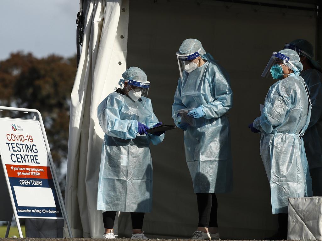 The 14-day quarantine period for any person in Victoria who becomes a close contact to a positive Covid-19 case in a workplace or social setting was slashed to seven days. Picture: NCA NewsWire/Daniel Pockett