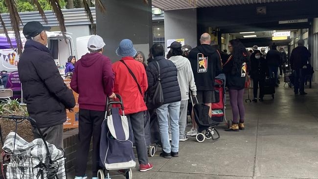 The crowd at OzHarvest’s free supermarket in Sydney is diverse and a stark reminder that it can be easy to suddenly not be able to afford groceries.