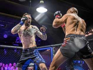 Zane Brassington (left) in action at the start of a fight he won by a TKO after 15 seconds  in mixed martial arts. Picture: Contributed