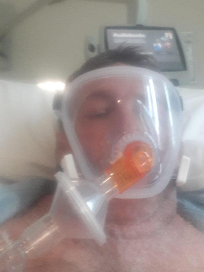 A UK COVID-19 patient lies in hospital on a ventilator.