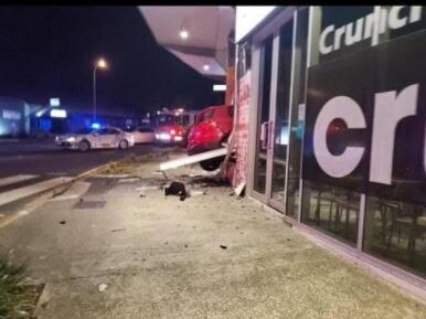 Social media users have shared images of a car crashed into a shopping centre at Newmarket in Brisbane's north.