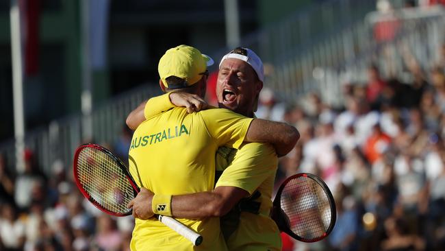 Australia's John Peers (L) celebrates with teammate Lleyton Hewitt. Picture; AFP