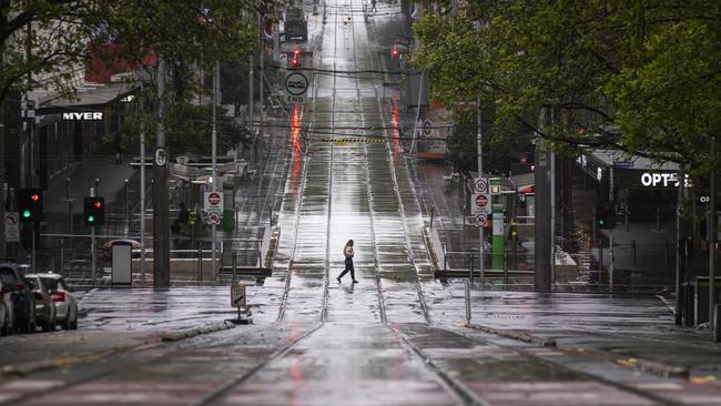 A lone person crosses a quiet Bourke Street Mall. Picture: Getty Images