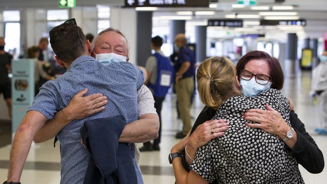 Passengers are greeted by loved ones as a flight from Sydney arrives at Perth Airport on December 8. Picture: Matt Jelonek/Getty Images