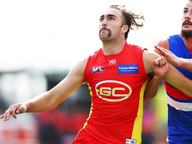 MELBOURNE, VICTORIA - MAY 05: Brayden Crossley of the Suns (L) and Tom Boyd of the Bulldogs compete for the ball during the round seven AFL match between the Western Bulldogs and the Gold Coast Suns at Mars Stadium on May 5, 2018 in Melbourne, Australia.  (Photo by Michael Dodge/AFL Media/Getty Images)