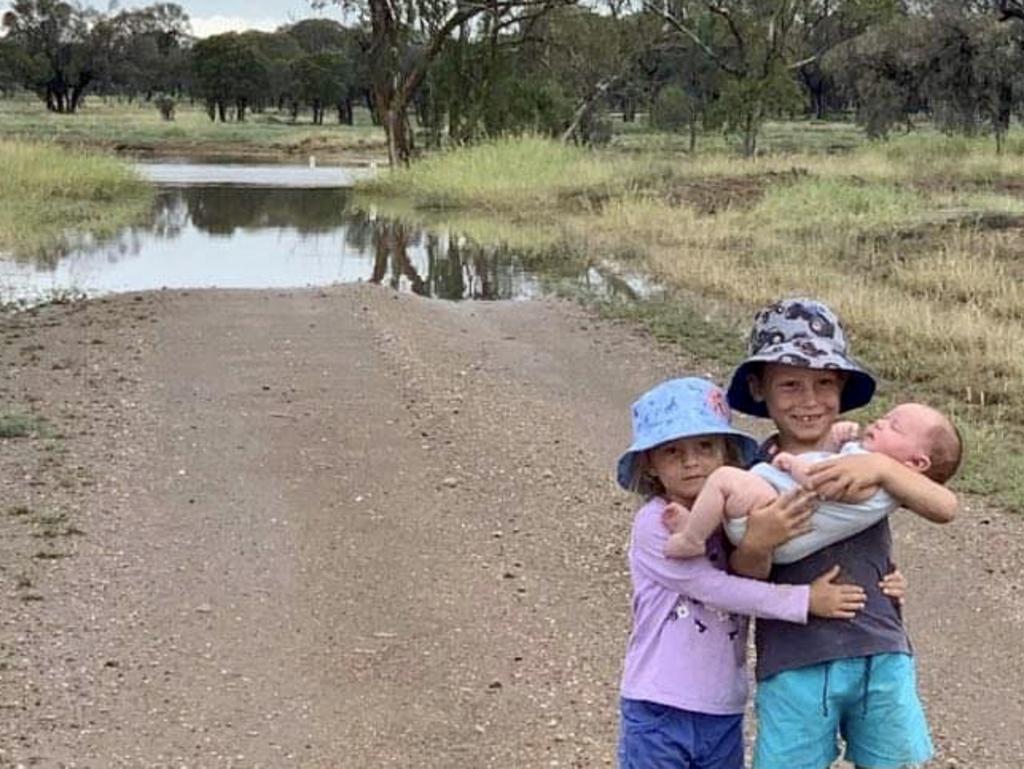 Savannah, Bailee and Fletcher Hoch excited about the recent rainfall at Woodbrook, Alpha, which recorded 81mm on Monday morning.