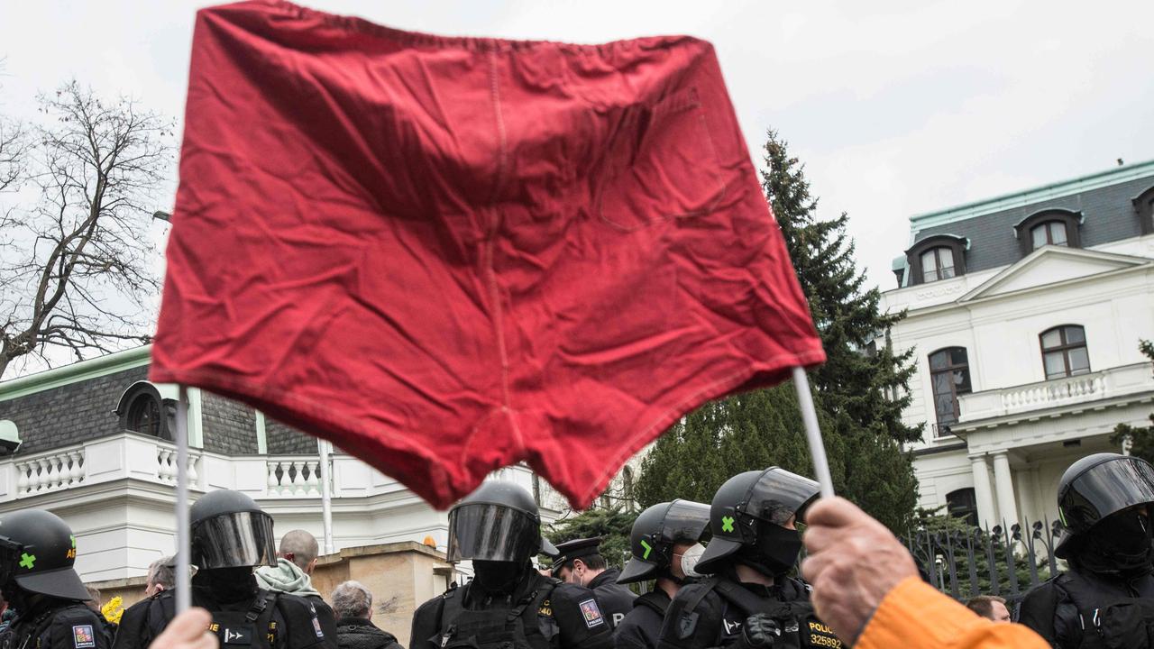 Protesters hold up a flag made of red underwear during a rally in front of the Russian Embassy in Prague. Czech Prime minister Andrej Babis and Czech Foreign Minister Jan Hamacak announced on April 17, 2021 that the Czech Republic would expel Russian diplomats. Picture: Michal Cizek / AFP