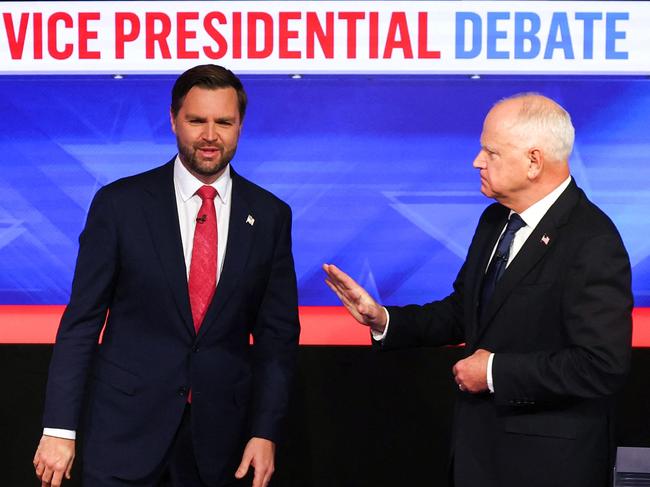 US Senator and Republican vice presidential candidate J.D. Vance (L) and Minnesota Governor and Democratic vice presidential candidate Tim Walz arrive to participate in the Vice Presidential debate hosted by CBS News at the CBS Broadcast Center in New York City on October 1, 2024. (Photo by Charly TRIBALLEAU / AFP)