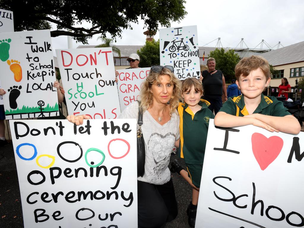 Carla Proietti, with her kids Solene and Nicholas Krause rallying against The Gabba Olympics stadium plan, which they fear will see their school permanently closed. Photo Steve Pohlner