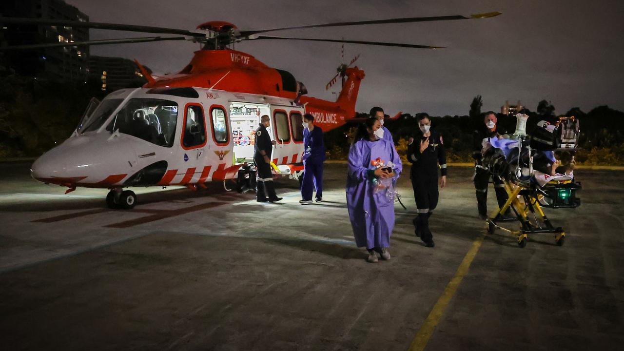 A patient arrives by air ambulance following a car crash. Picture: David Caird