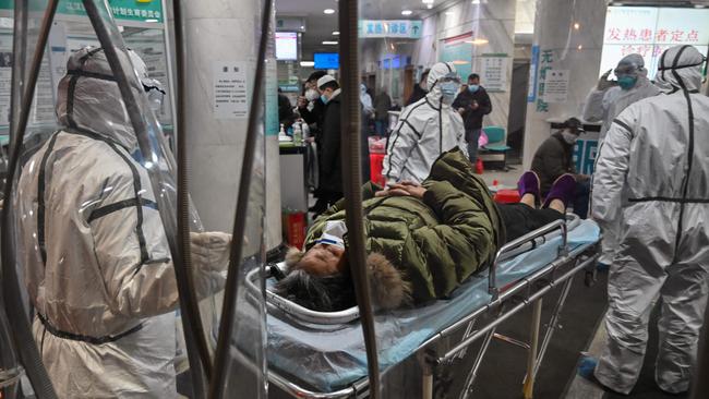 A patient arrives at the Wuhan Red Cross Hospital in Wuhan on January 25. Picture: AFP/Hector Retamal