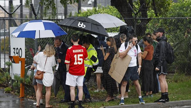 Despite the weather, many loyal fans still braved the trip to the airport to welcome Taylor Swift to the city. Picture: NCA NewsWire Richard Dobson