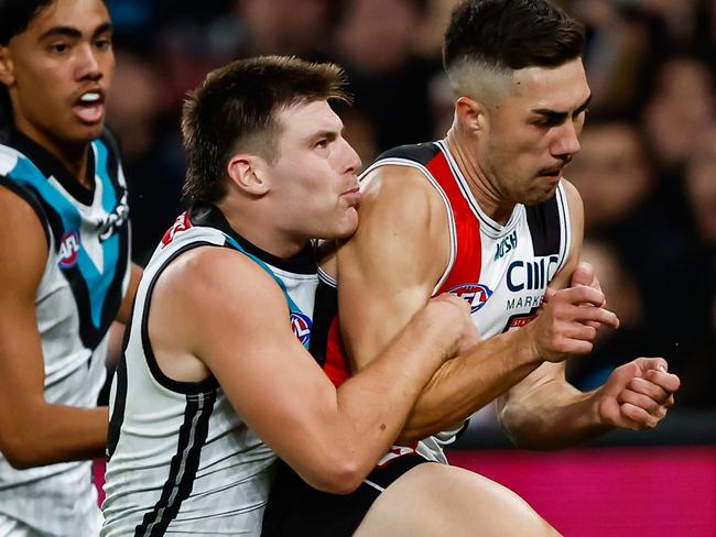 MELBOURNE, AUSTRALIA - APRIL 28: Jade Gresham of the Saints kicks a goal as he is tackled by Dylan Williams of the Power during the 2023 AFL Round 07 match between the St Kilda Saints and the Port Adelaide Power at Marvel Stadium on April 28, 2023 in Melbourne, Australia. (Photo by Dylan Burns/AFL Photos via Getty Images)