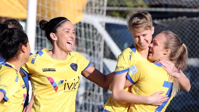 Dolphins players celebrate Emily Anderson’s opening goal. Picture: Richard Gosling