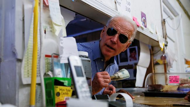 Joe Biden settles the bill at a diner in Hemingway, South Carolina, on Friday. Picture: Reuters