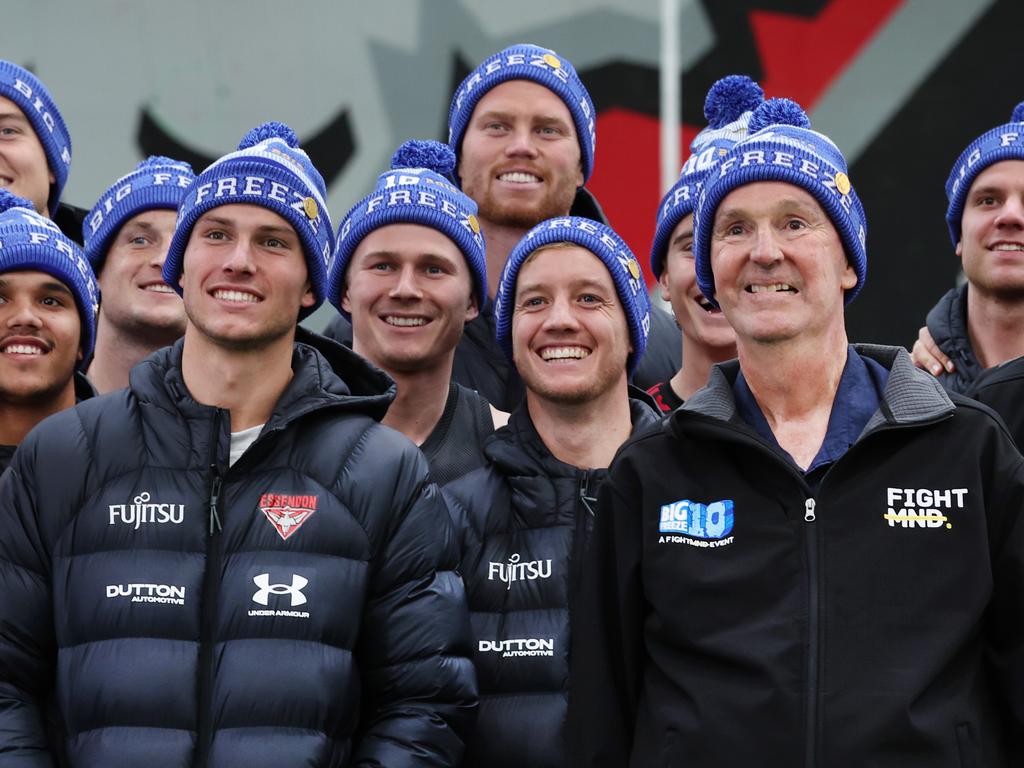 Neale Daniher with Essendon football club players at the Hanger ahead of Freeze at the G. Picture: David Caird