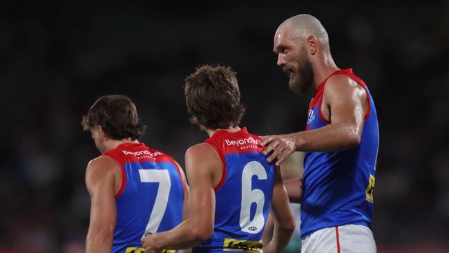 MELBOURNE, AUSTRALIA - FEBRUARY 28: Max Gawn of the Demons (R) celebrates a goal to Caleb Windsor of the Demons (C) during the 2024 AFL Community Series match between Carlton Blues and Melbourne Demons at Ikon Park on February 28, 2024 in Melbourne, Australia. (Photo by Daniel Pockett/Getty Images)