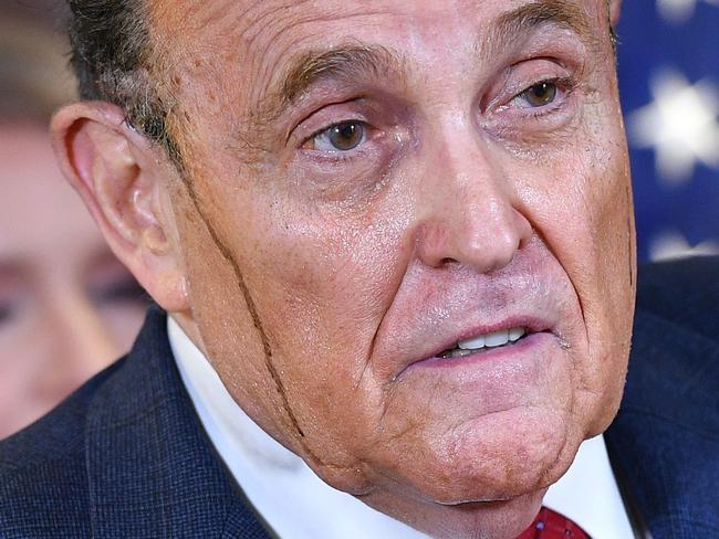 Former New York Mayor Rudy Giuliani sweats out his hair dye as he tries to convince the world Donald Trump won the election. Picture: AFP