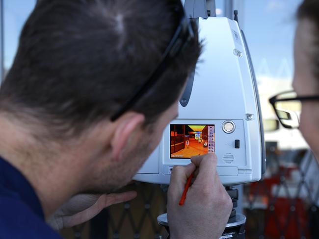 Forensic experts create a digital 3D representation of the Bankstown crime scene today.