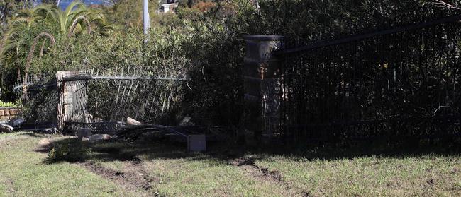 The iron and sandstone fence outside a home in Caladenia Cl where the Holden Commodore left the road. Picture: David Swift