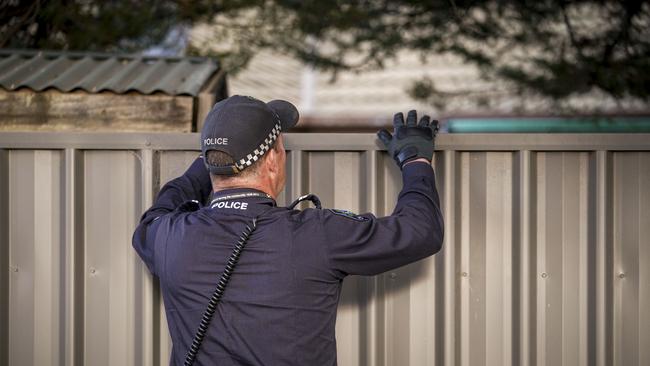 Police at the scene of a stabbing on Sunburt Street, Ingle Farm. Picture: Mike Burton