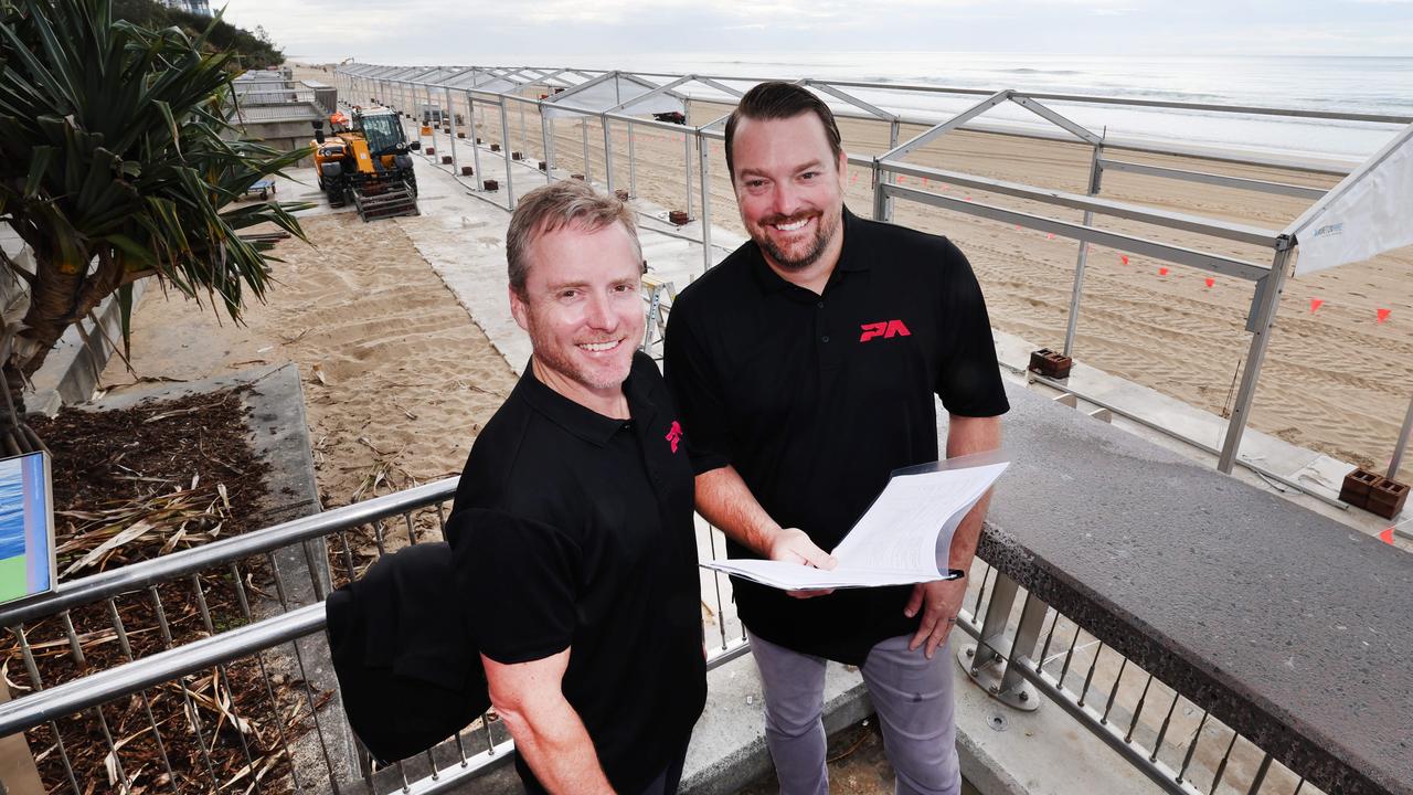 Pacific Airshow Chief Operating Officer Sam Pearce and Director Kevin Elliott check over works taking place on Surfers Paradise beach for the big event. Picture Glenn Hampson