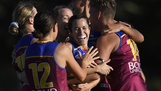 The Lions get around goalsneak Alexandra Anderson. Picture: Getty Images