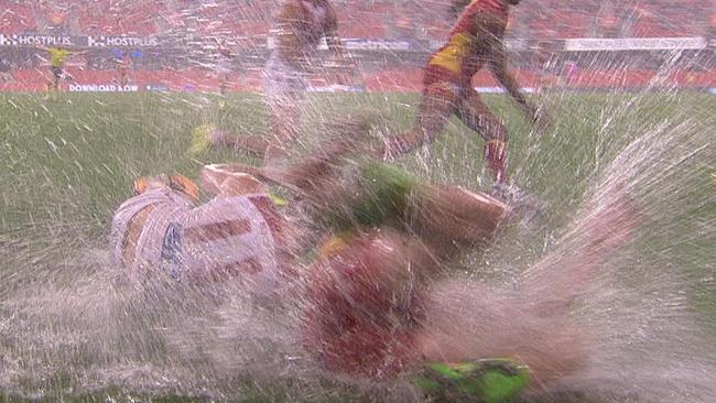 Wet conditions met the players at Metricon Stadium.