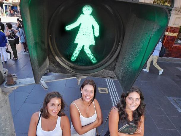 DIGITALLY ALTERED SIGN-WOMAN ADDED TO CROSSING LIGHT L-R Jena gotziaman 25, Kayleigh rockett 23 and Krysti Gotziaman 27. Melbourne has taken a step towards gender parity with the launch of the Equal Crossings initiative with ligts featuring a female figure to be unveiled at the intersection of Flinders and Swanston Streets. Picture: Jason Edwards
