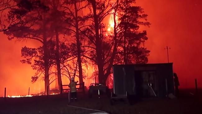 Vision compliments of FIRE & RESCUE NSW who were doing fire protection on Braddocks Rd, Orangeville when a number of properties came under ember attack and crown fires across tree tops. Picture: FIRE and RESCUE NSW