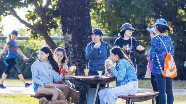 People have lunch at Burleigh Heads. Picture: NIGEL HALLETT