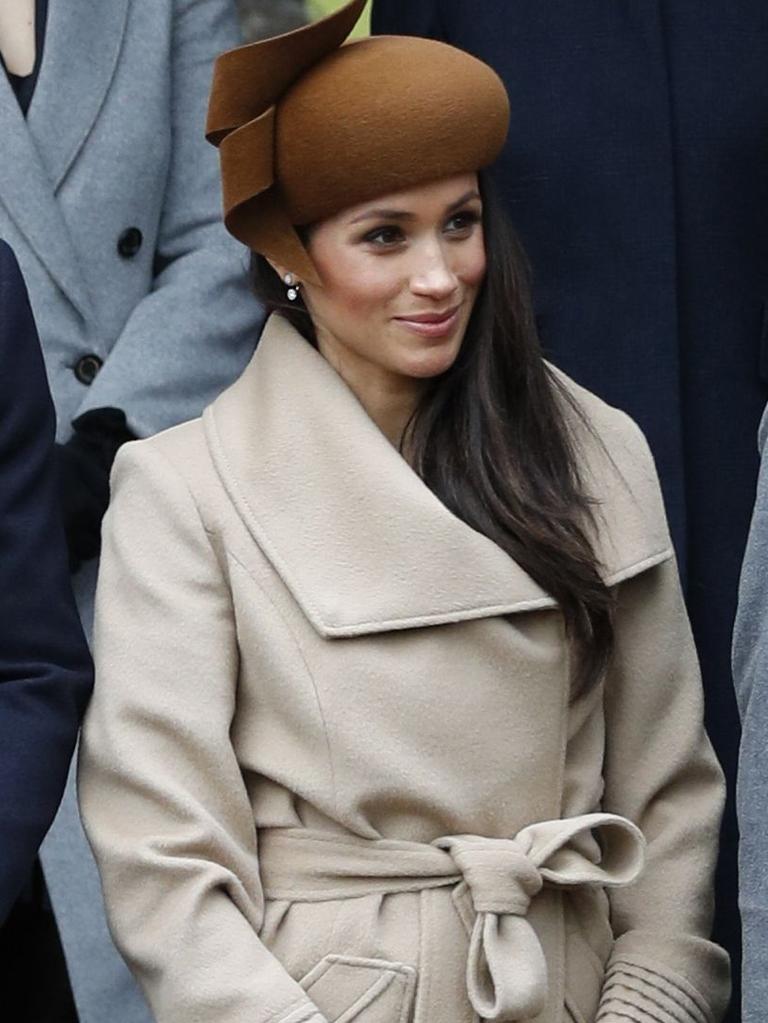 She was wearing the same coat she wore on Christmas Day in 2017. Picture: AFP Photo/Adrian Dennis